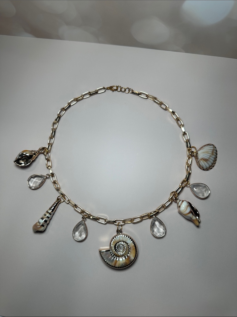 Gold Shell Charm Necklace with Clear Teardrop Accents - Picture 2 of 2